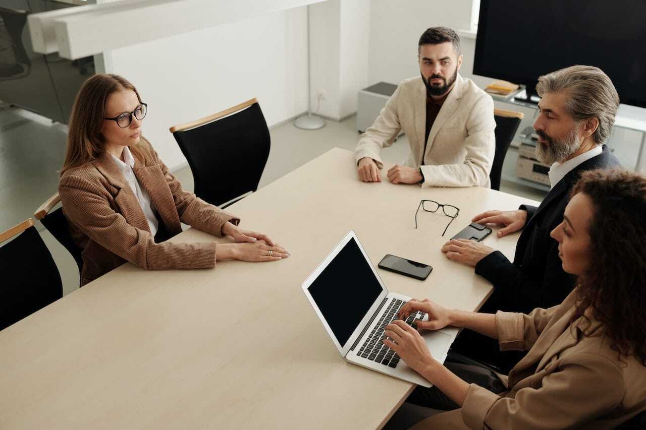 Why do companies hire through staffing agencies?